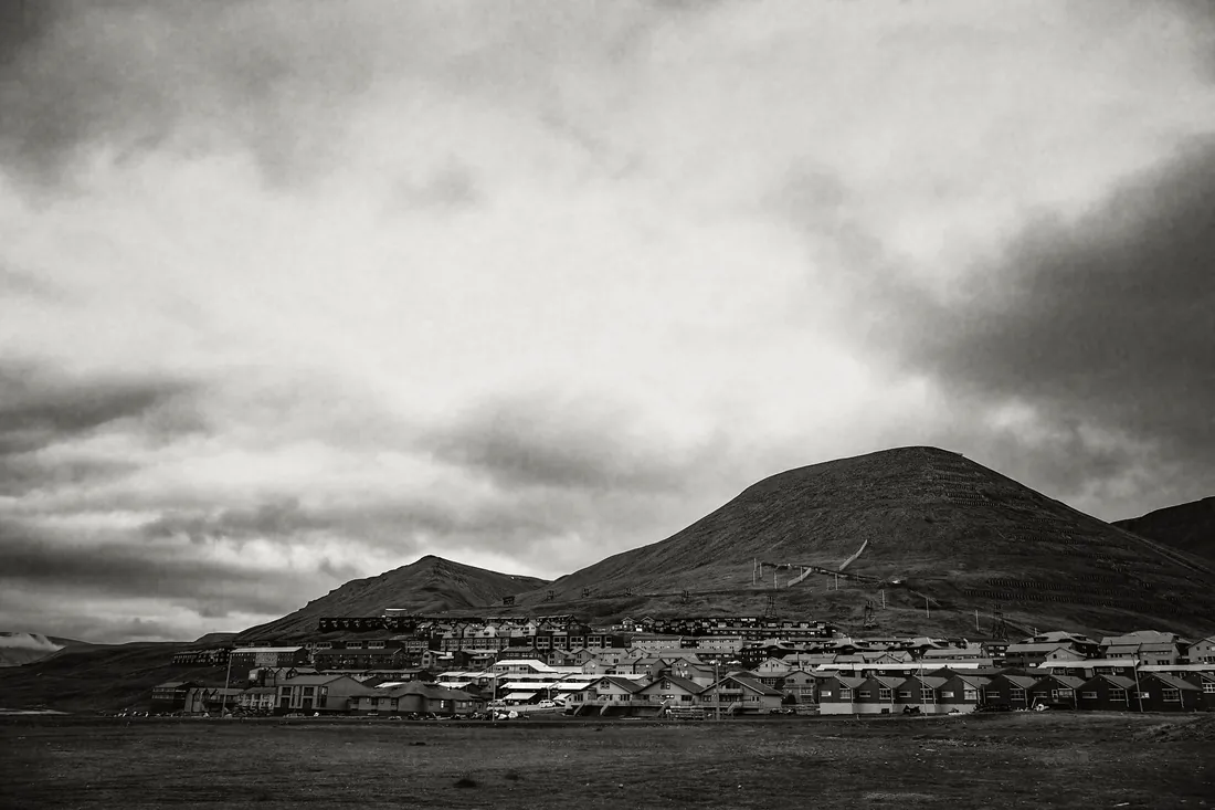 Longyearbyen seen from the fjord, houses below the mountain