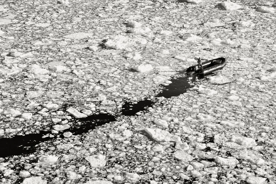 Zodiac moving through pack ice, seen from above
