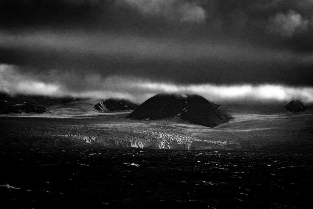 Glacier under a storm sky
